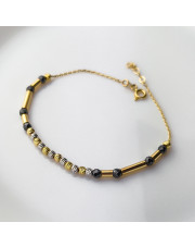 Złota bransoletka z czarnymi kulkami - pr.585