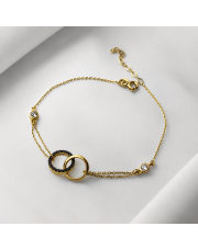 Złota bransoletka złączone Ringi z czarnymi i białymi cyrkoniami 19,5 cm - pr. 585 